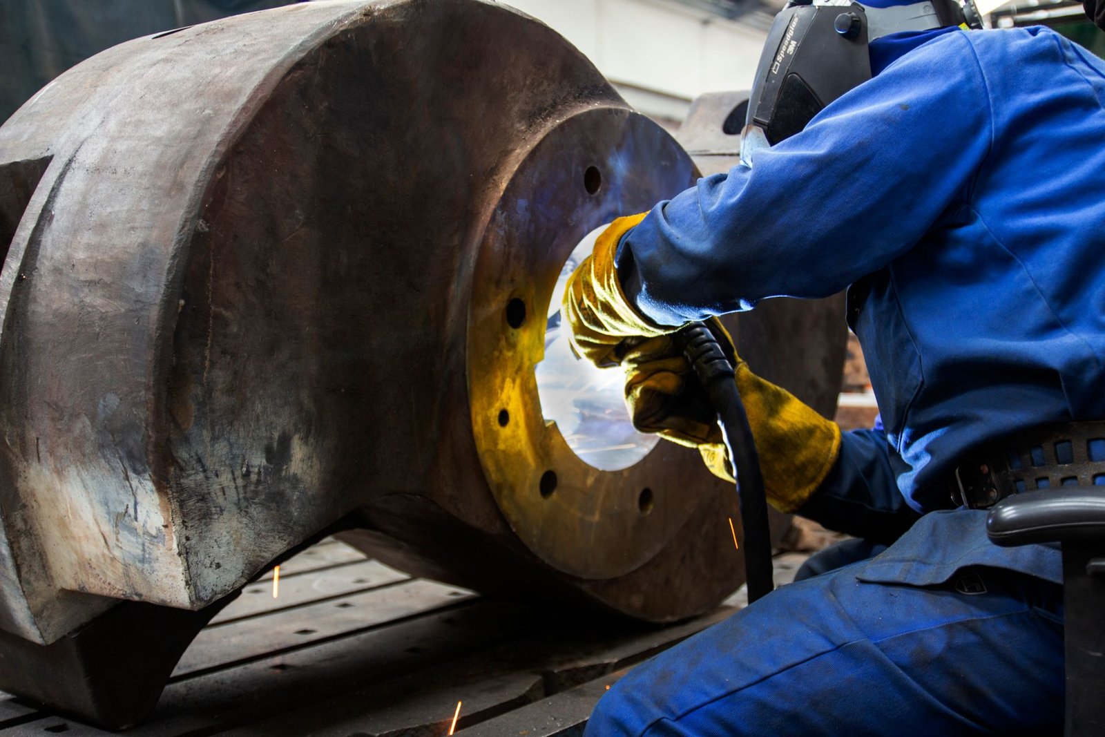 Technician working on industrial equipment at a site